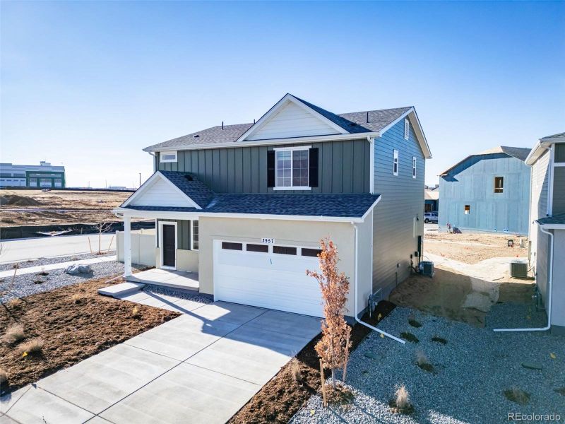 Front exterior of a new home in , Aurora, CO, highlighting curb appeal (Image 1).