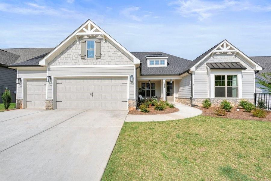 Front exterior of a new home in Soleil Belmont Park, Canton, GA, highlighting curb appeal (Image 1). Front exterior of a new home in Soleil Belmont Park, Canton, GA, highlighting curb appeal (Image 1).