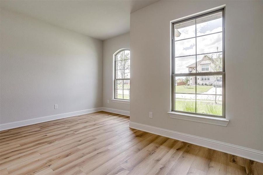 Unfurnished room featuring light hardwood / wood-style floors