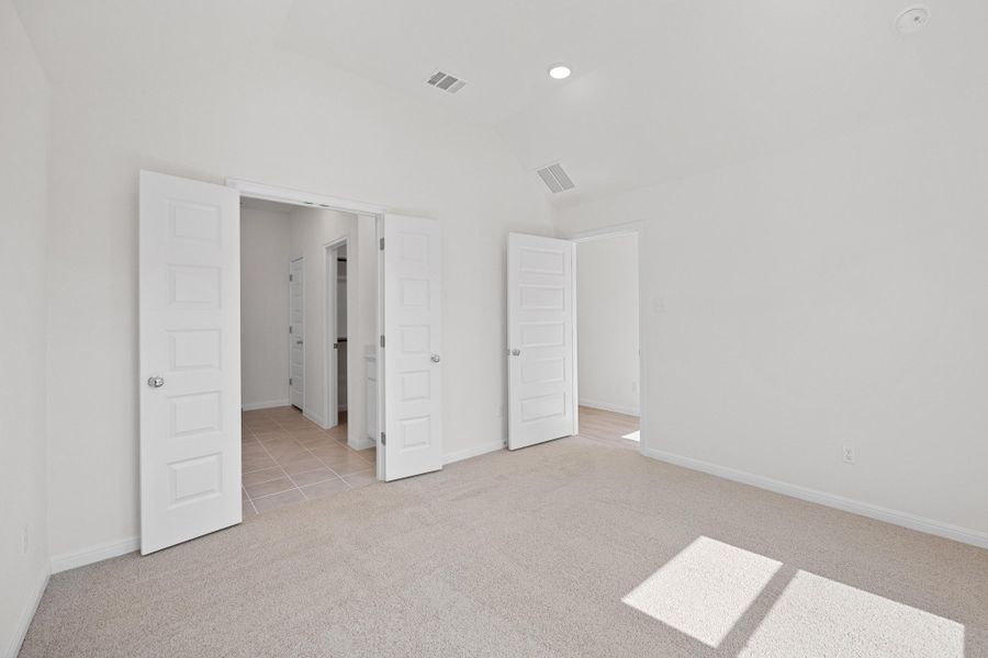 Primary Bedroom in the Cypress home plan by Trophy Signature Homes - REPRESENTATIVE PHOTO