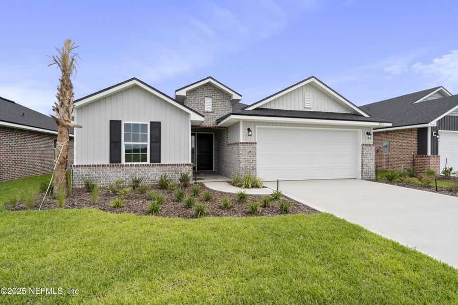 Front exterior of a new home in Shadow Crest at Rolling Hills, Green Cove Springs, FL, highlighting curb appeal (Image 16).