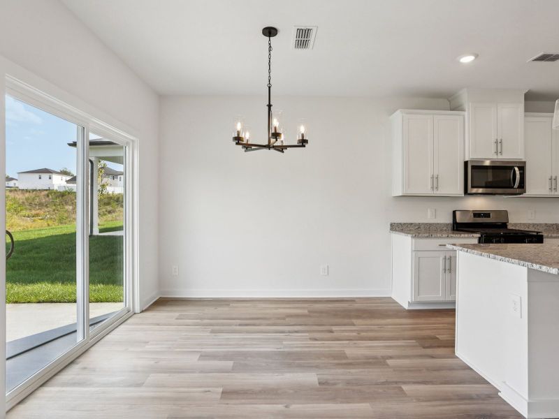 The open-concept floorplan allows for an easy flow between the kitchen and dining areas.