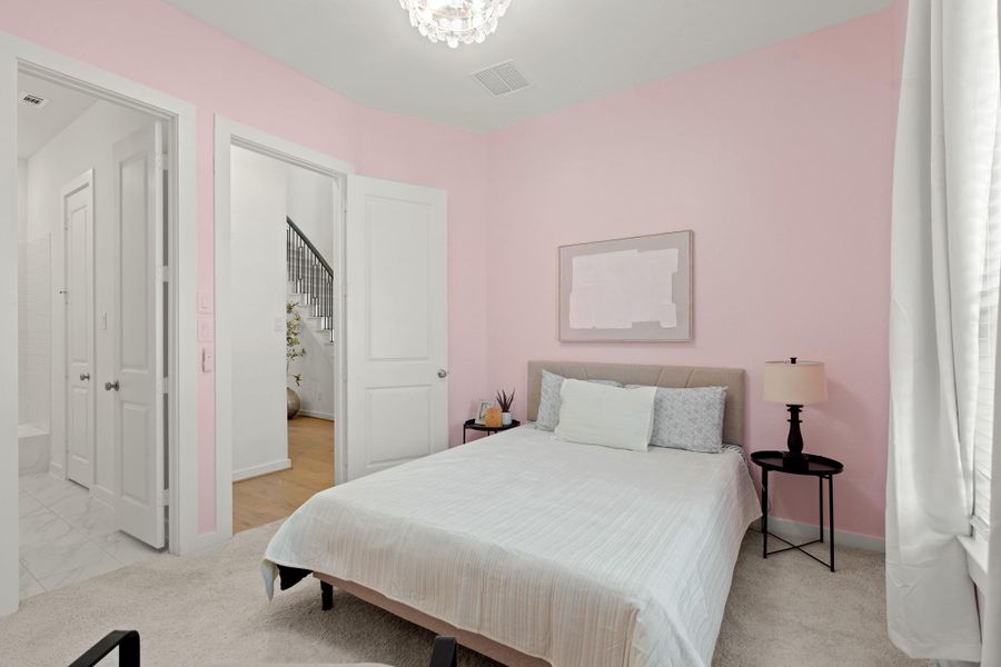 Nestled away quietly, the guest suite is tucked towards the front of the home away from the secondary bedrooms and primary for optimal privacy.