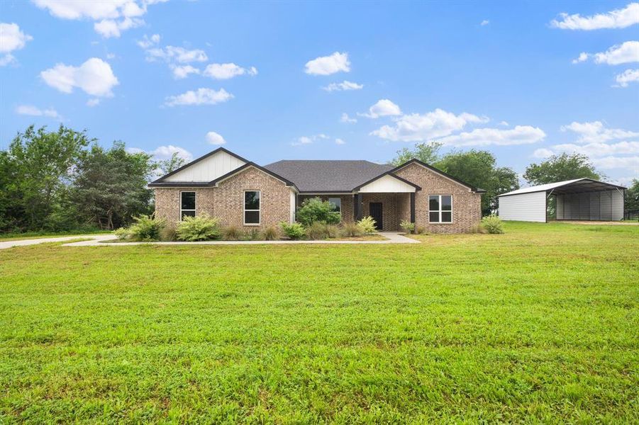 Front exterior of a new home in , Greenville, TX, highlighting curb appeal (Image 23).