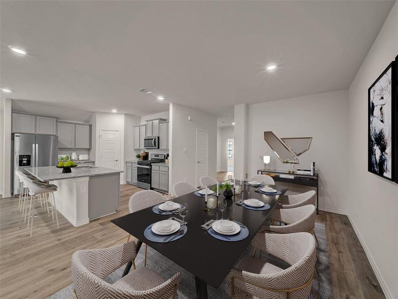 Dining area featuring visible vents, recessed lighting, light wood finished floors, and baseboards