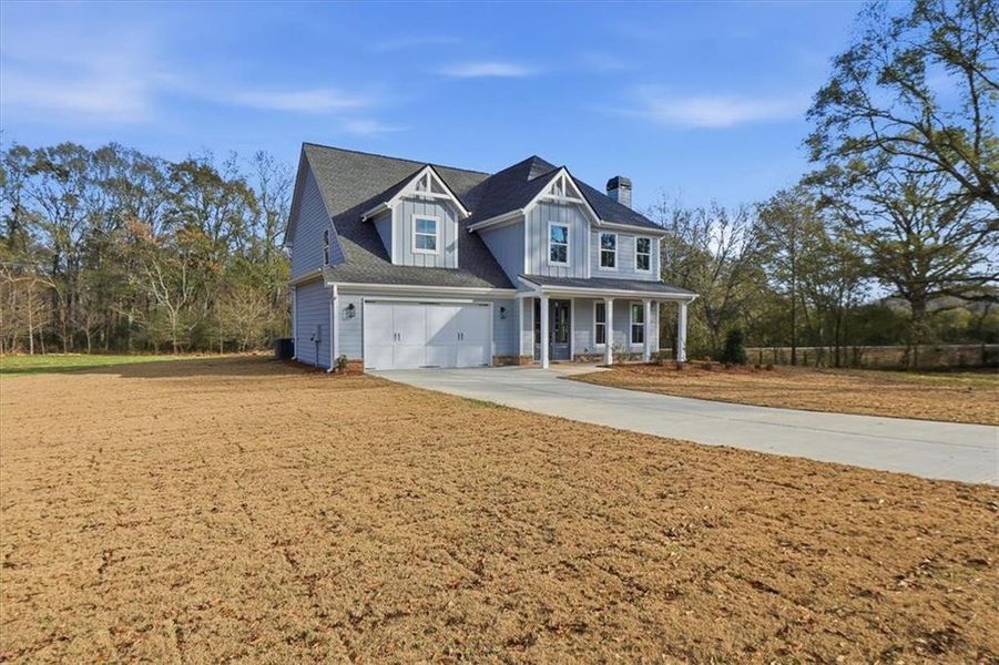 Front exterior of a new home in , Statham, GA, highlighting curb appeal (Image 33). Front exterior of a new home in , Statham, GA, highlighting curb appeal (Image 33).