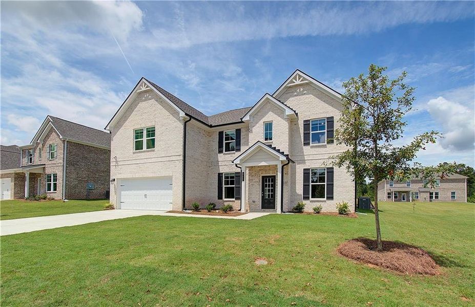 Front exterior of a new home in Westwind Estates, Hampton, GA, highlighting curb appeal (Image 2).