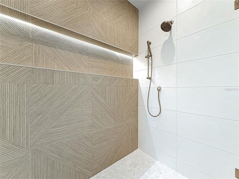 Spa-like en-suite bath featuring dual sinks, an oversized walk-in shower, and a private water closet. Spa-like en-suite bath featuring dual sinks, an oversized walk-in shower, and a private water closet.