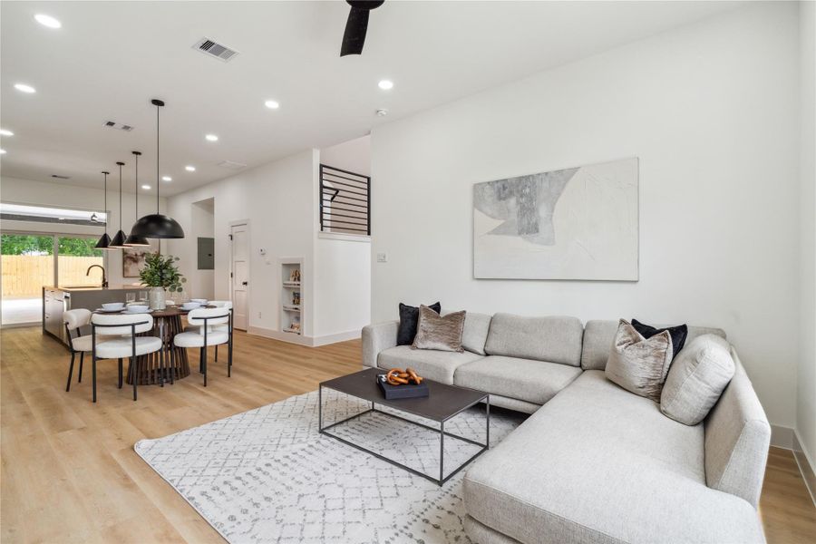 This open-concept design brings the heart of the home together—seamlessly connecting kitchen, dining, and living spaces for comfort, flow, and everyday ease.