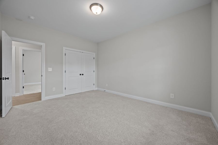 Spacious, unfurnished interior of a new home in The Preserve at Langston, Winterville (Image 50).