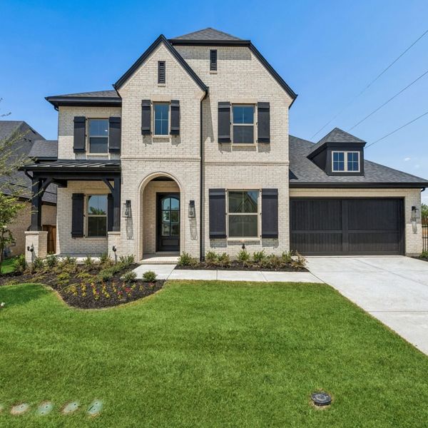 Front exterior of a new home in The Parks at Wilson Creek, Celina, TX, highlighting curb appeal (Image 2). Front exterior of a new home in The Parks at Wilson Creek, Celina, TX, highlighting curb appeal (Image 2).