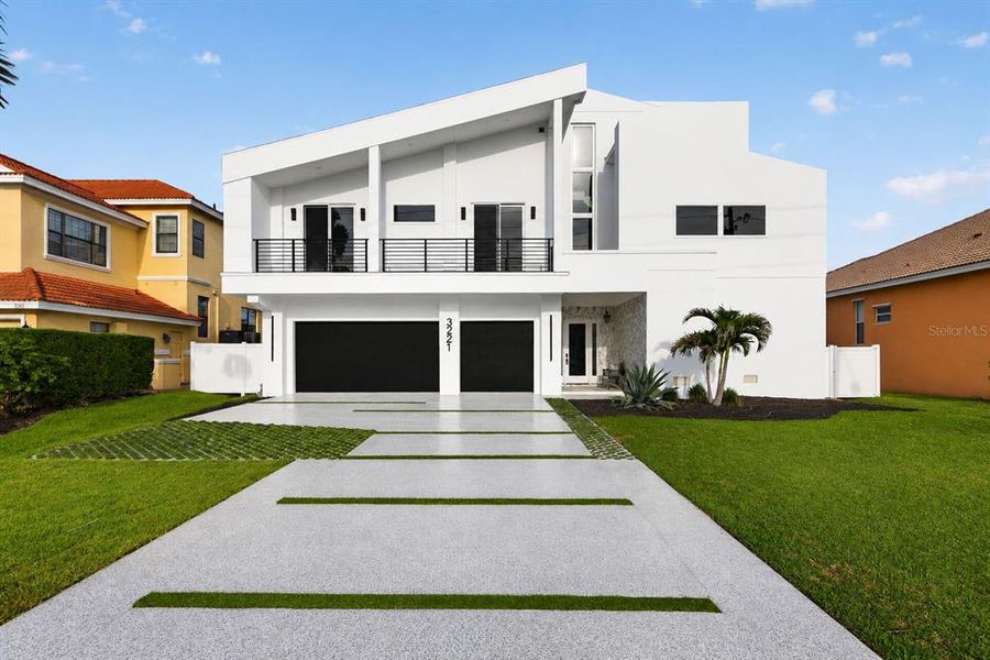 Front exterior of a new home in , Belleair Beach, FL, highlighting curb appeal (Image 34).