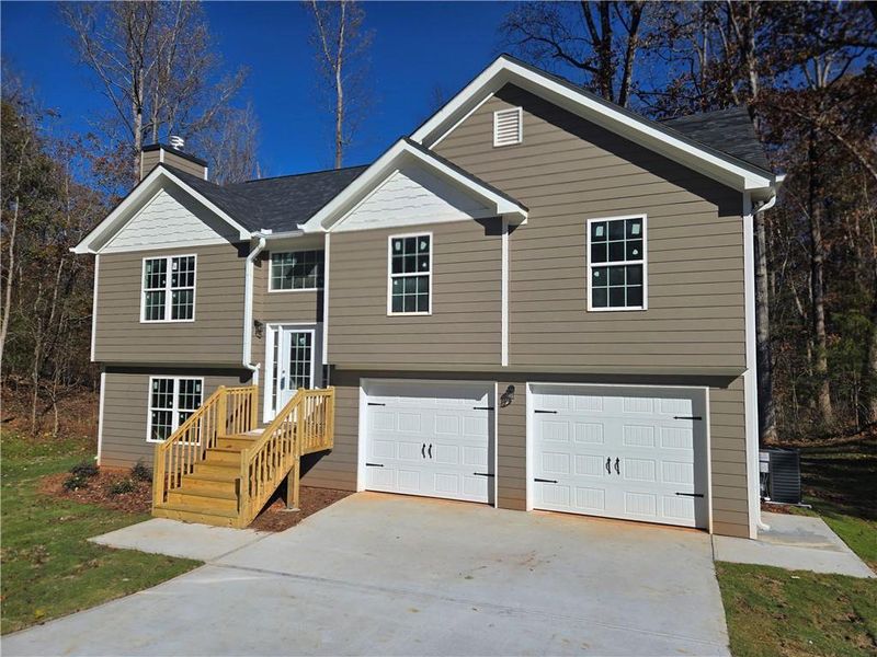 Front exterior of a new home in , Gainesville, GA, highlighting curb appeal (Image 1).