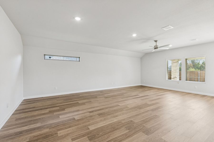 Living and Dining Rooms in the Oscar home plan by Trophy Signature Homes – REPRESENTATIVE PHOTO