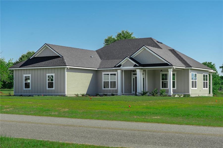 Front exterior of a new home in , Live Oak, FL, highlighting curb appeal (Image 12).