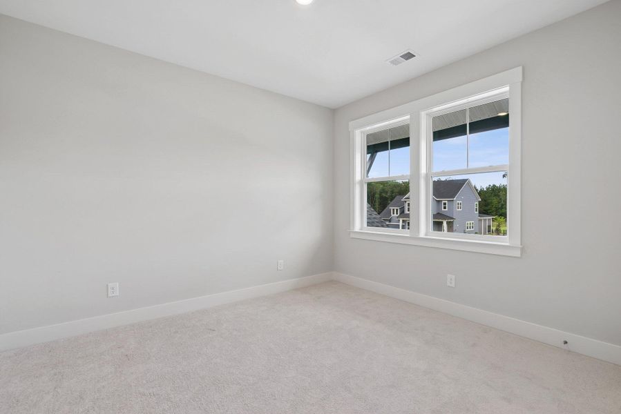 Spacious, unfurnished interior of a new home in Hidden Ponds Reserve, Awendaw (Image 47).