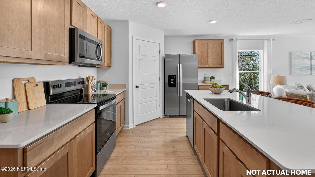 Furnished interior view inside a new home in Sawmill Branch, Palm Coast (Image 8).