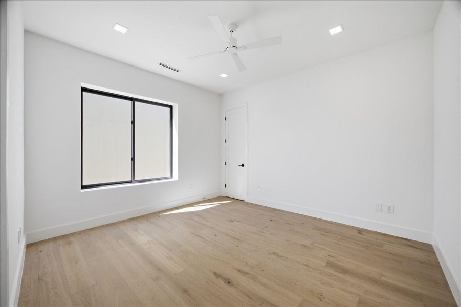 Each upstairs bedroom is thoughtfully designed with generous proportions, abundant natural light, and a clean, modern aesthetic.