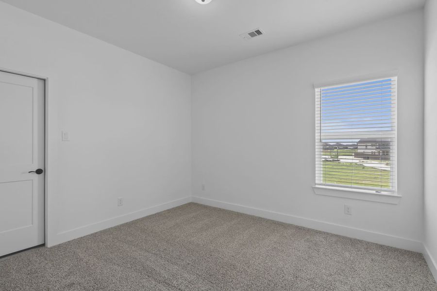 Representative unfurnished interior of a home built from the St Andrews by Chesmar Homes in Riceland Alley Loads, Mont Belvieu (Image 47).