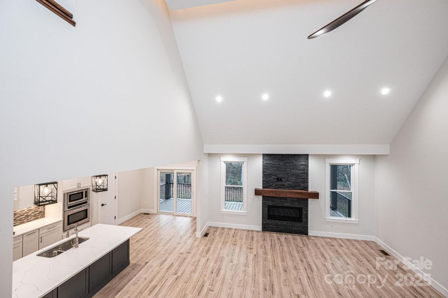Looking down from the upstairs level to the Kitchen, Breakfast Area and 2 Story Great Room with Fireplace. Looking down from the upstairs level to the Kitchen, Breakfast Area and 2 Story Great Room with Fireplace.