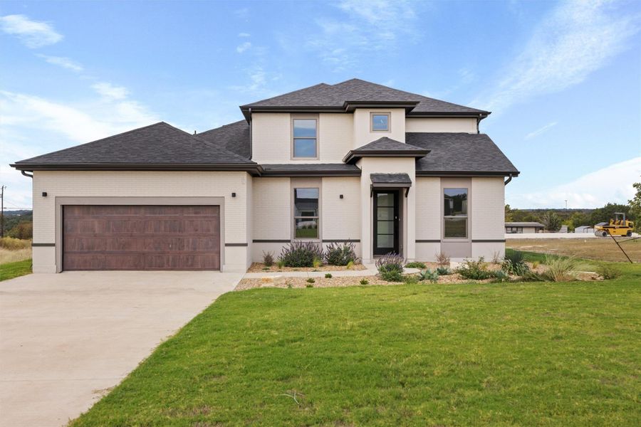 Front exterior of a new home in , Georgetown, TX, highlighting curb appeal (Image 2). Front exterior of a new home in , Georgetown, TX, highlighting curb appeal (Image 2).