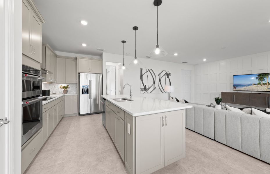 Designer kitchen that overlooks the spacious gathe