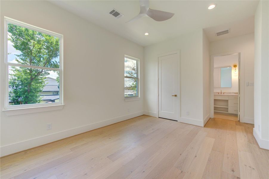 The second floor features three generously sized secondary bedrooms, each thoughtfully designed with its own private ensuite bath, offering exceptional comfort, privacy, and convenience for family members and guests alike.