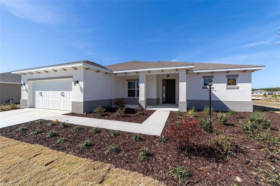 Front exterior of a new home in On Top of the World Communities, Ocala, FL, highlighting curb appeal (Image 19).