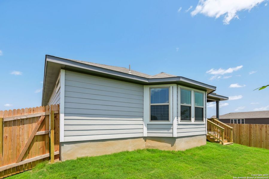 Front exterior of a new home in Catalina, Converse, TX, highlighting curb appeal (Image 20).