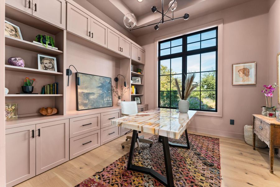 Office featuring light wood finished floors and a chandelier Office featuring light wood finished floors and a chandelier