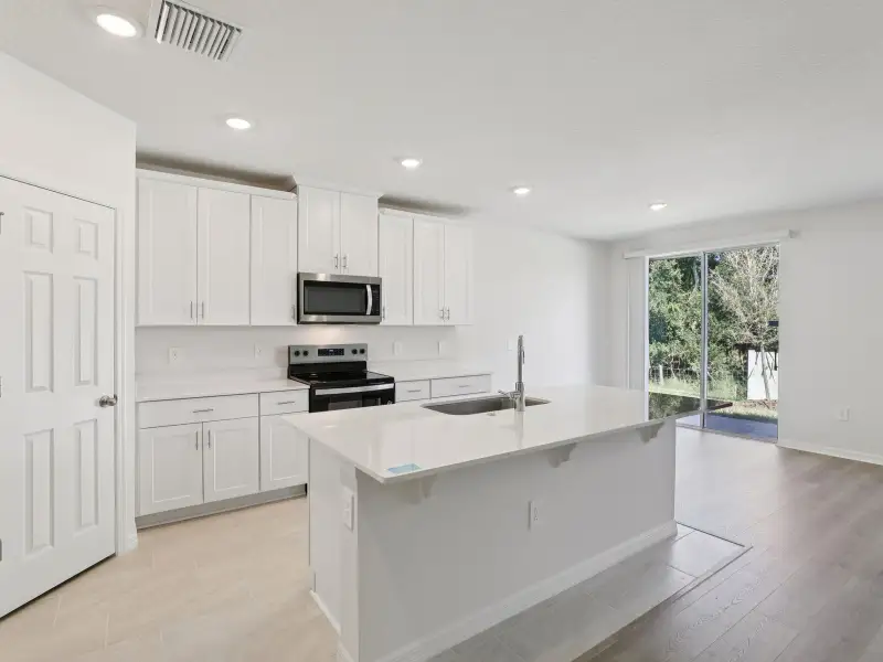 Furnished interior view inside a new home in Springs at Lake Alfred - Signature Series, Lake Alfred (Image 2). Furnished interior view inside a new home in Springs at Lake Alfred - Signature Series, Lake Alfred (Image 2).