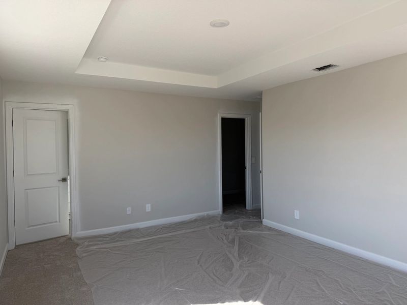 Primary suite provides a private oasis with a walk-in closet and en suite bathroom Primary suite provides a private oasis with a walk-in closet and en suite bathroom