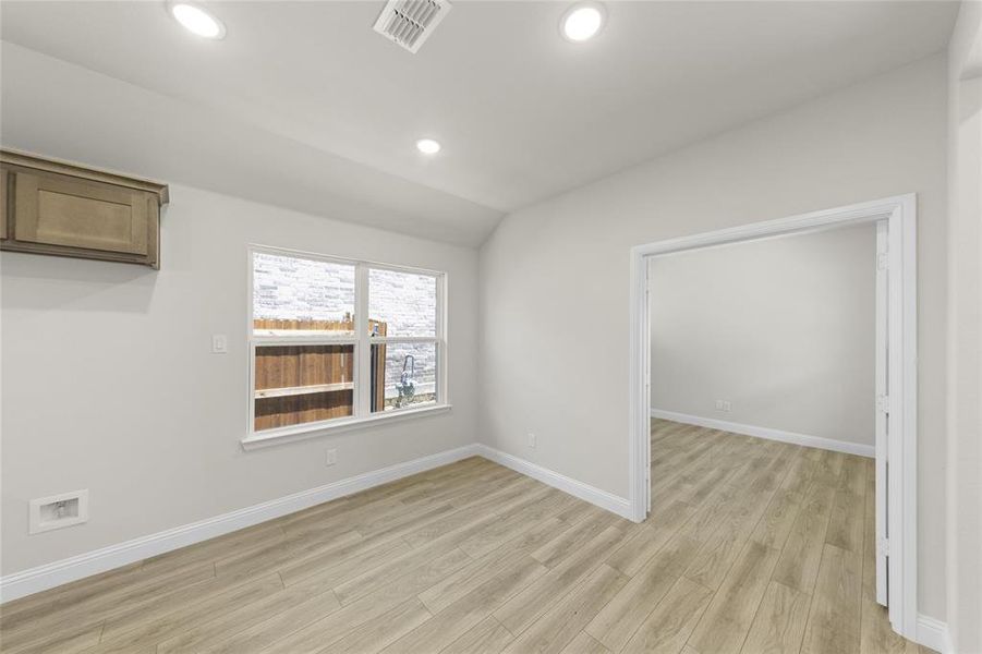 Spare room featuring light wood-type flooring