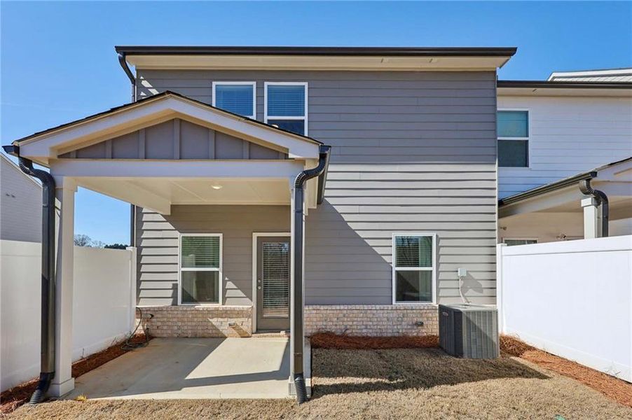 Exterior details and patio area of a home in Eastlyn Crossing, Flowery Branch (Image 26).