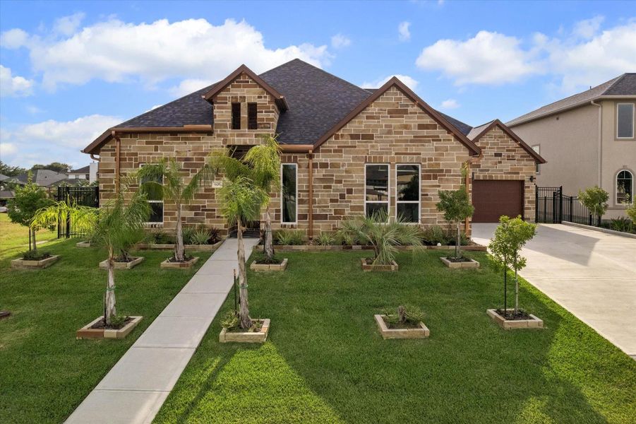 Front exterior of a new home in , Kemah, TX, highlighting curb appeal (Image 25). Front exterior of a new home in , Kemah, TX, highlighting curb appeal (Image 25).