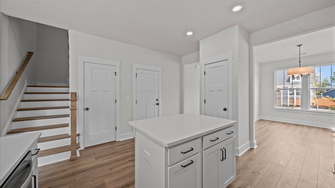 Accomplished kitchen design featuring a statement island for both prep and gathering