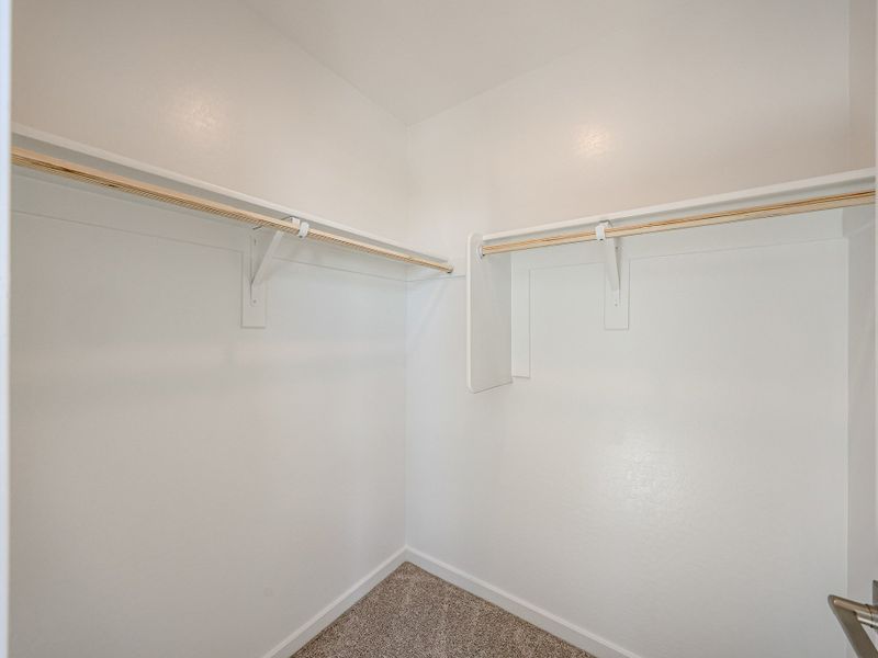 A white wall with a metal bar. A white wall with a metal bar.