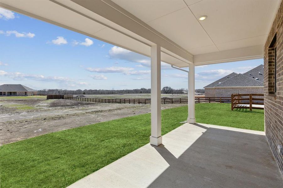 View of patio / terrace featuring a rural view and fence