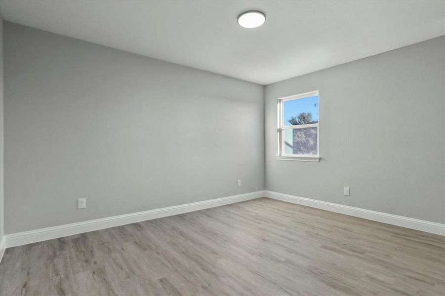 Unfurnished room featuring light wood-type flooring