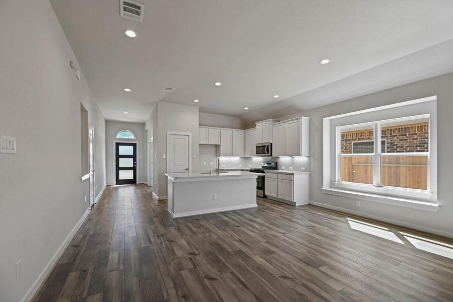 Furnished interior view inside a new home in Sunterra, Katy (Image 9).