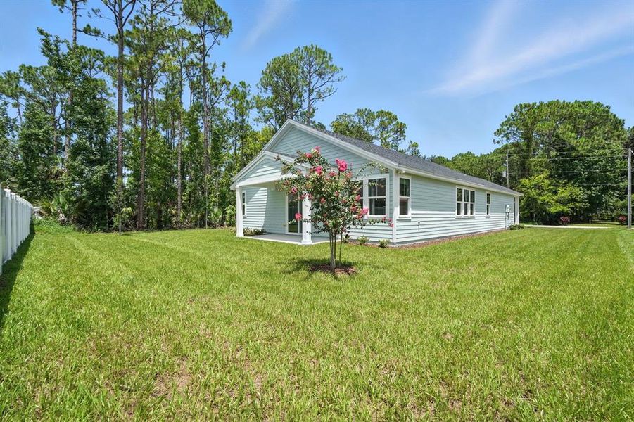 Front exterior of a new home in Palm Coast Homes, Palm Coast, FL, highlighting curb appeal (Image 21).