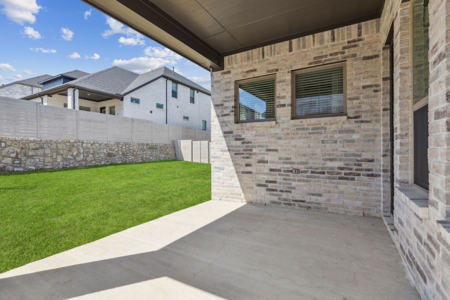 Covered Patio in the Picasso II home plan by Trophy Signature Homes – REPRESENTATIVE PHOTO