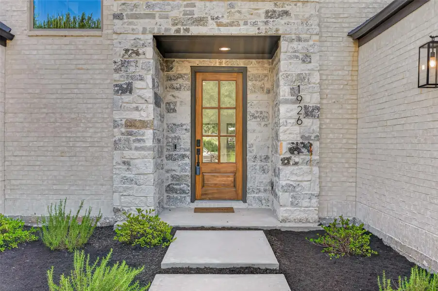 Exterior details and patio area of a home in , Conroe (Image 3).