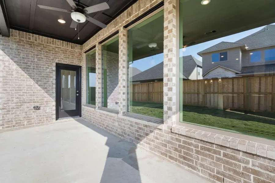 Exterior details and patio area of a home in Dunham Pointe 50', Cypress (Image 3).