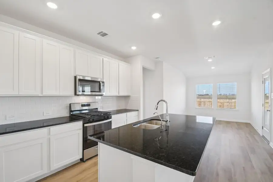 Furnished interior view inside a new home in , Conroe (Image 3).