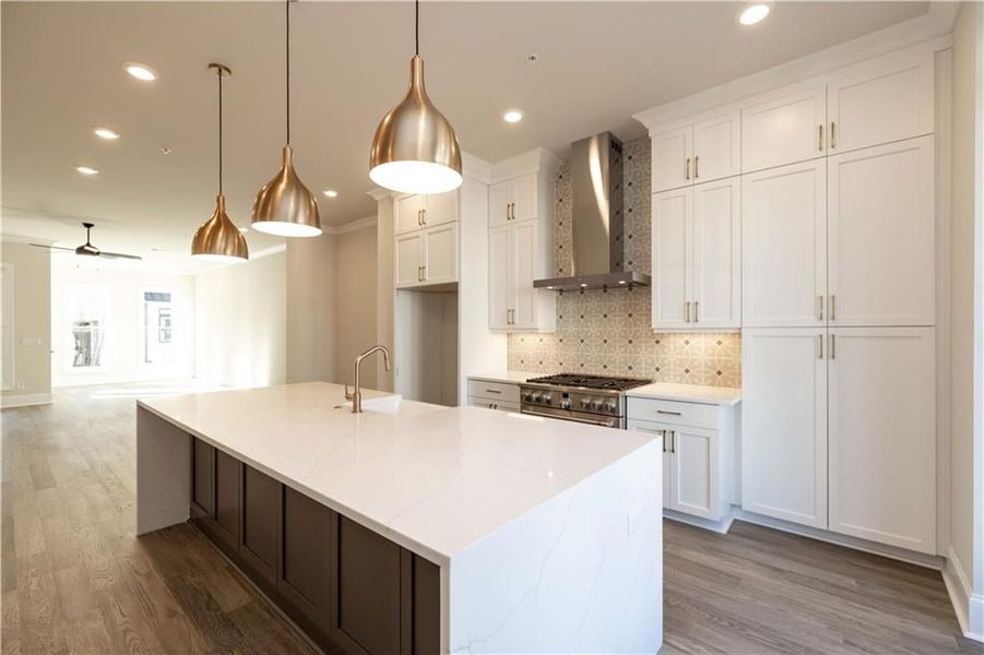 The open-concept kitchen offers excellent flow to the dining and living areas, making it the perfect hub for family and friends. These photos are from another community and are not representative of this homesite. The open-concept kitchen offers excellent flow to the dining and living areas, making it the perfect hub for family and friends. These photos are from another community and are not representative of this homesite.