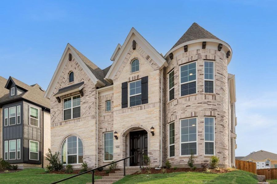 Front exterior of a new home in Trails at Cottonwood Creek, Rowlett, TX, highlighting curb appeal (Image 2). Front exterior of a new home in Trails at Cottonwood Creek, Rowlett, TX, highlighting curb appeal (Image 2).
