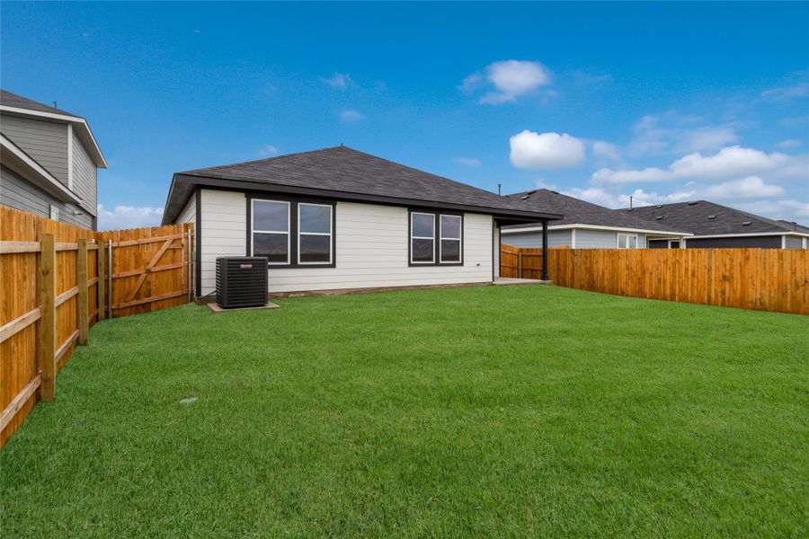 Front exterior of a new home in Monarch Ranch, Manor, TX, highlighting curb appeal (Image 20). Front exterior of a new home in Monarch Ranch, Manor, TX, highlighting curb appeal (Image 20).