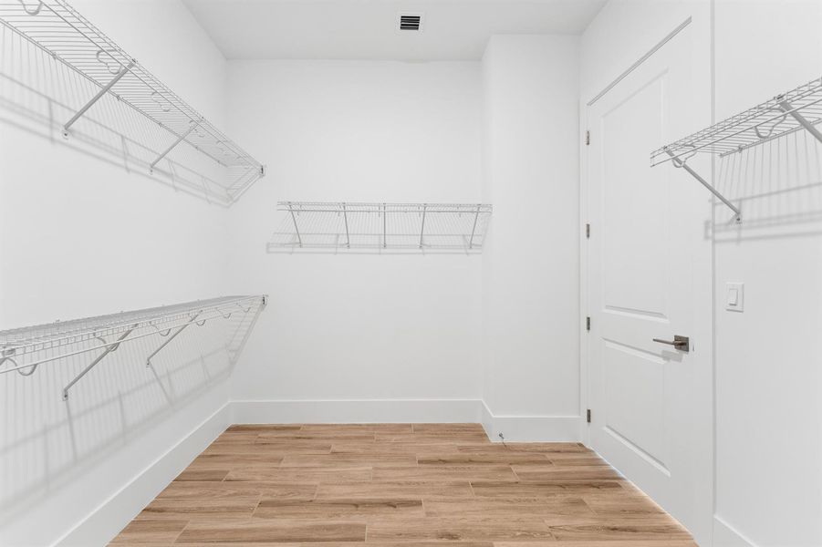 Primary Walk-in Closet Primary Walk-in Closet