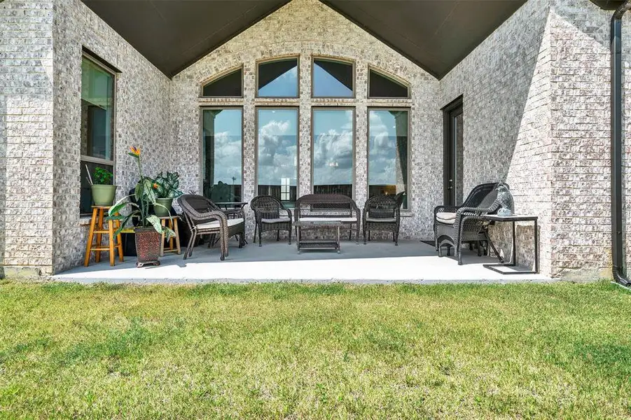 Front exterior of a new home in M3 Ranch 70', Mansfield, TX, highlighting curb appeal (Image 2). Front exterior of a new home in M3 Ranch 70', Mansfield, TX, highlighting curb appeal (Image 2).